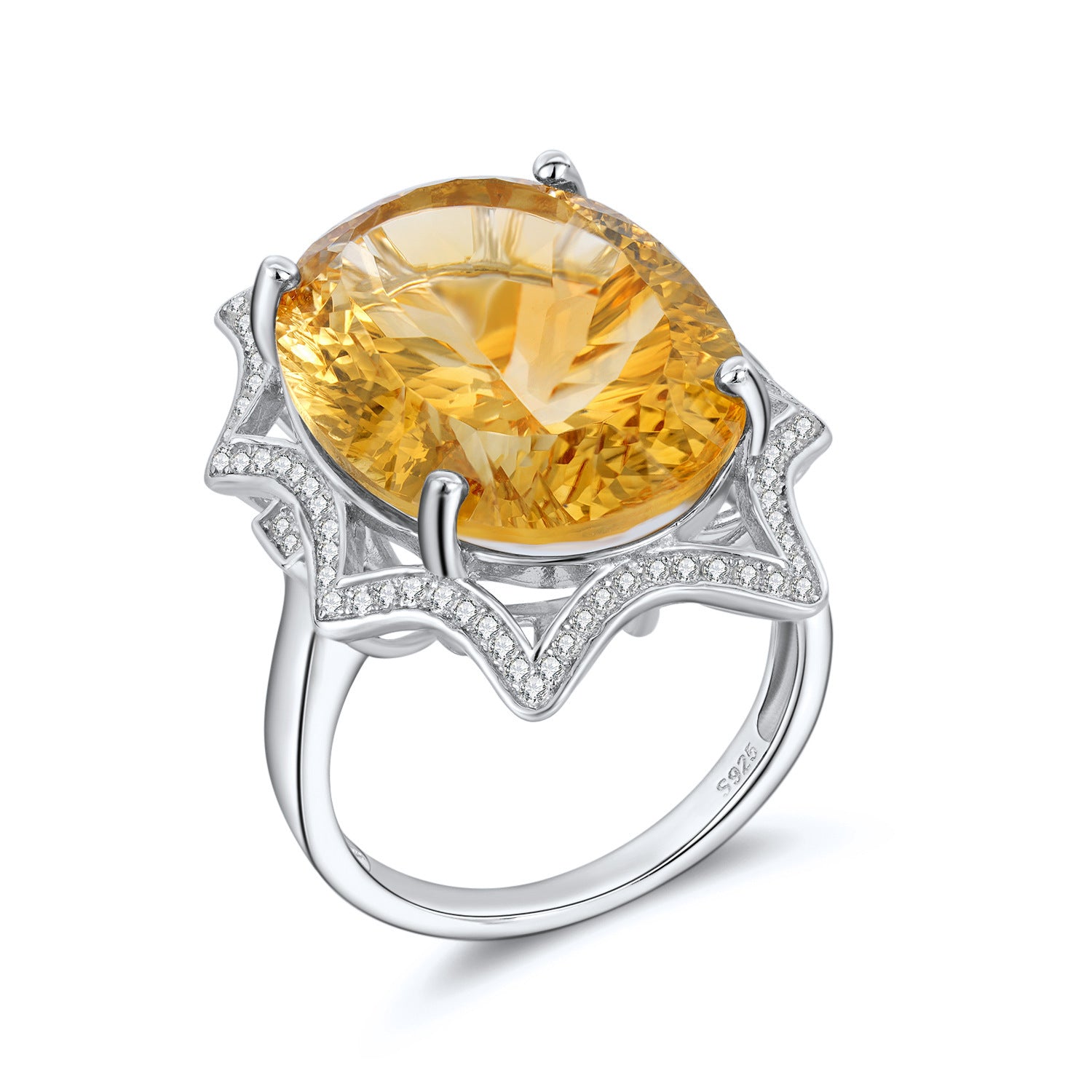 Ring with a large yellow gemstone and silver band on a white background