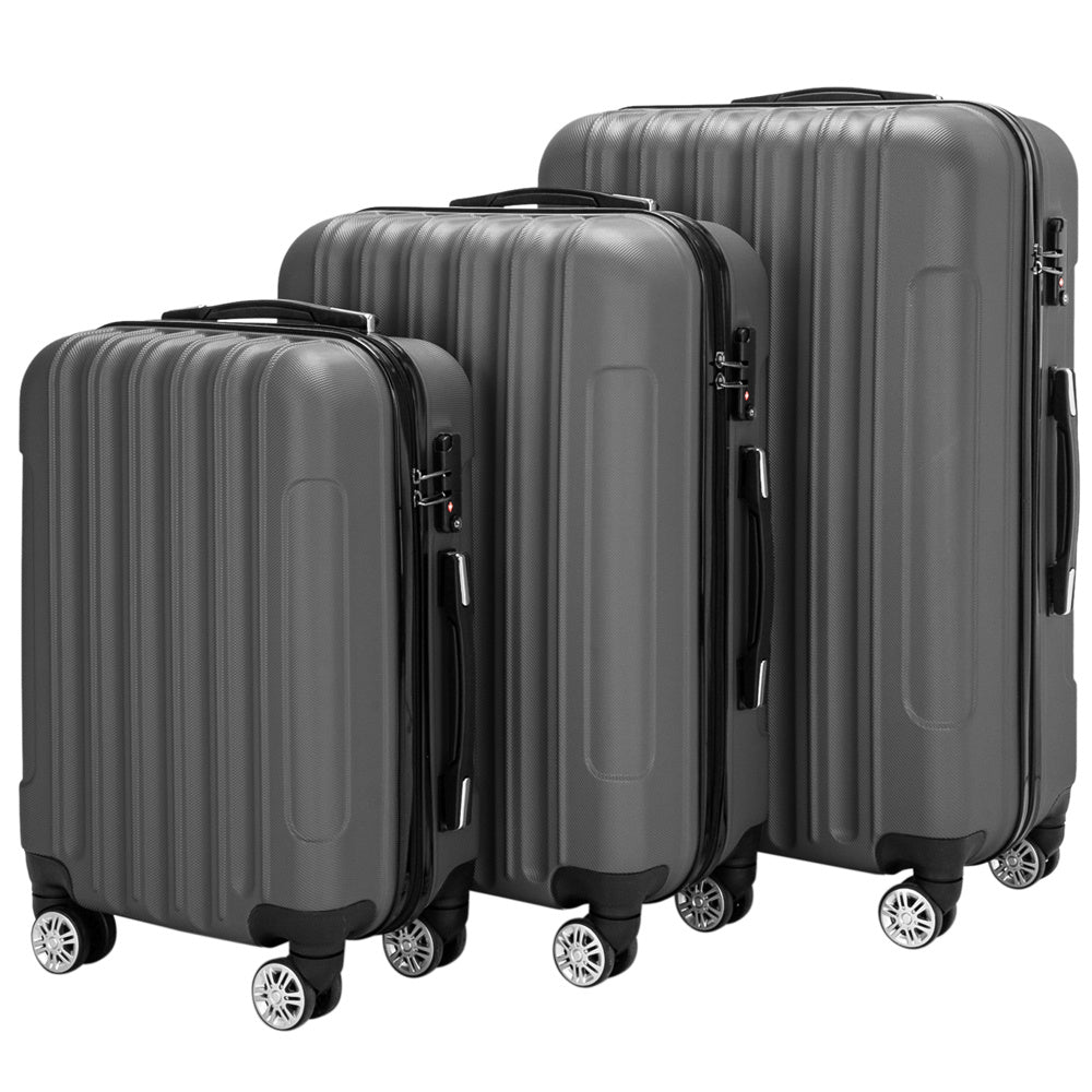 Set of three gray suitcases of different sizes on a white background