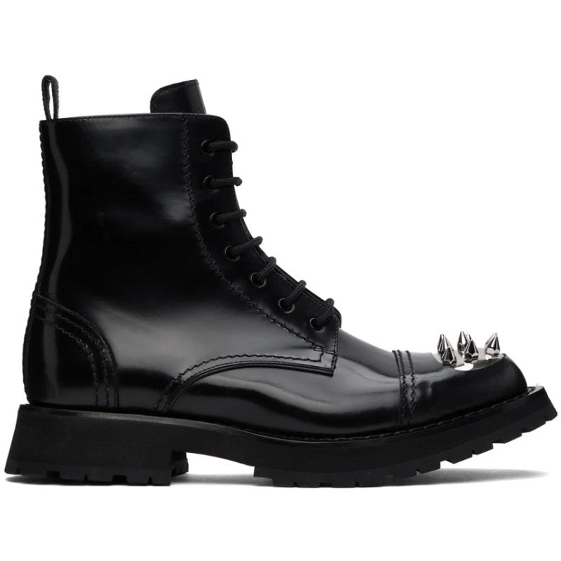 Black leather boot with spiked heel on a white background