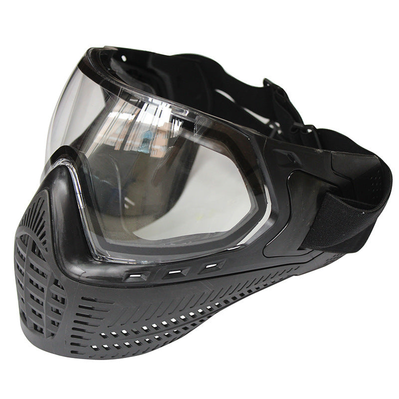 Black paintball mask with clear visor on a white background