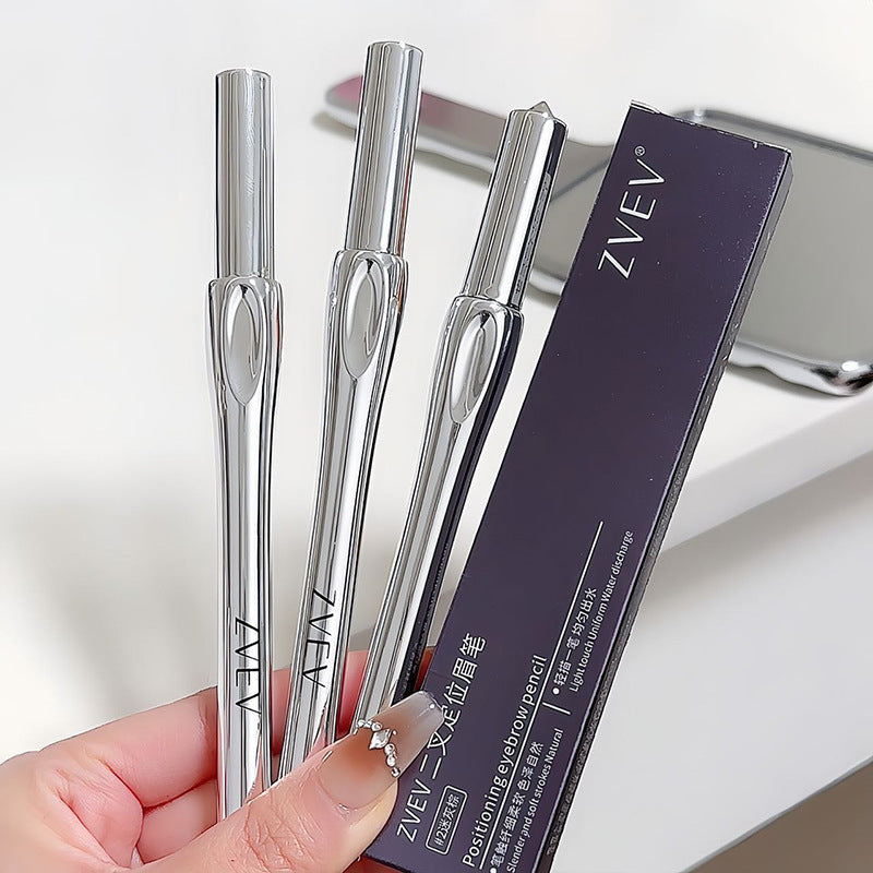 Three silver ZVEV eyebrow pens held by a hand with a blurred background