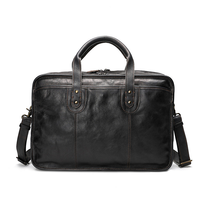 Black leather briefcase with shoulder strap on a white background