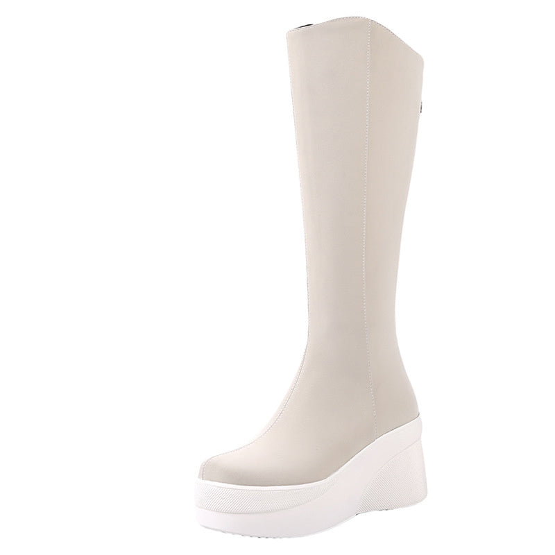 Beige knee-high boot on a white background