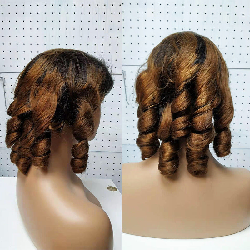 Two views of a brown wig on mannequin heads against a white background