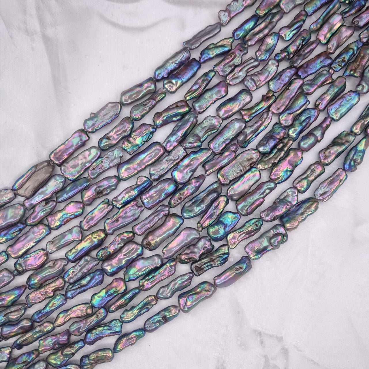 Iridescent baroque pearls on a white background