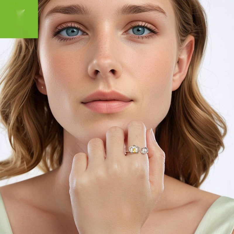 Woman wearing a ring with a green square label in the corner
