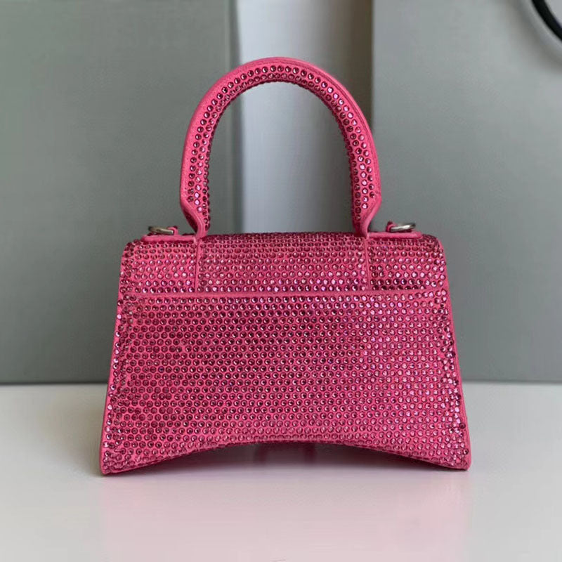 Pink textured handbag on a neutral background