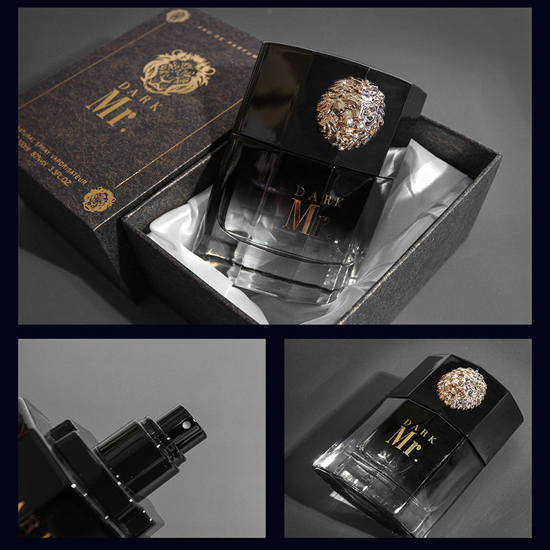 Black perfume bottle with gold lion emblem and packaging on a gray background