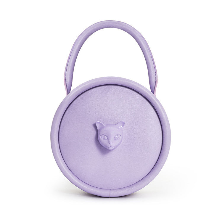 Lavender round container with a cat face emblem on a white background