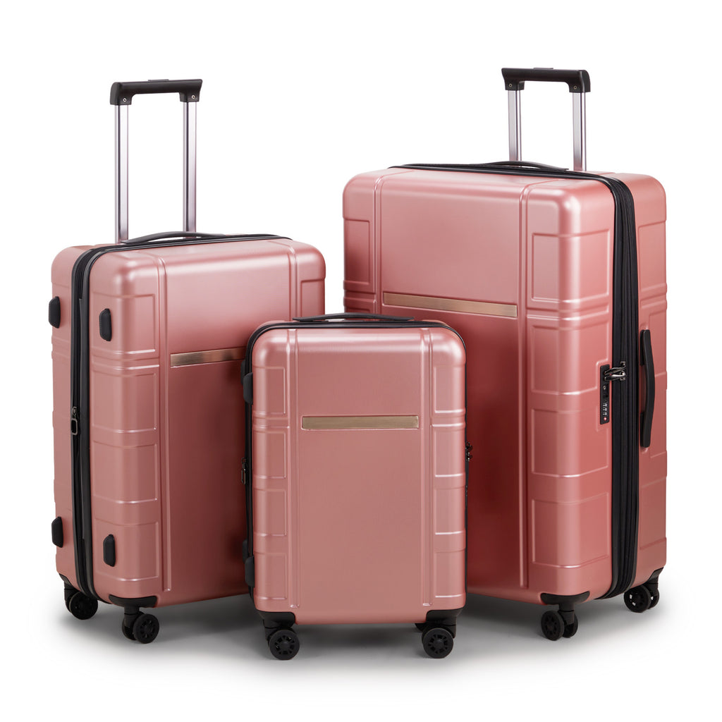 Set of three rose gold suitcases with black handles and wheels on a white background
