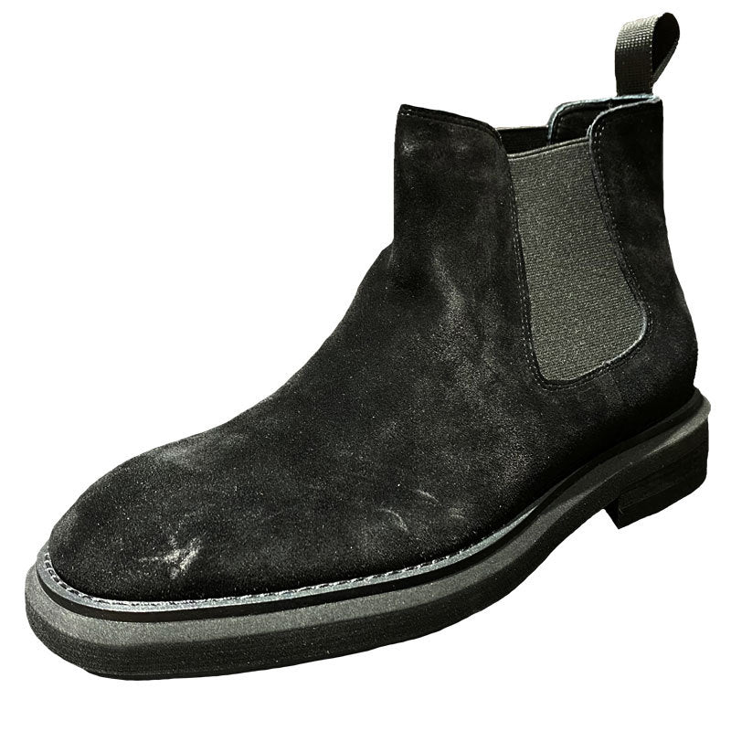 Black Chelsea boot on a white background