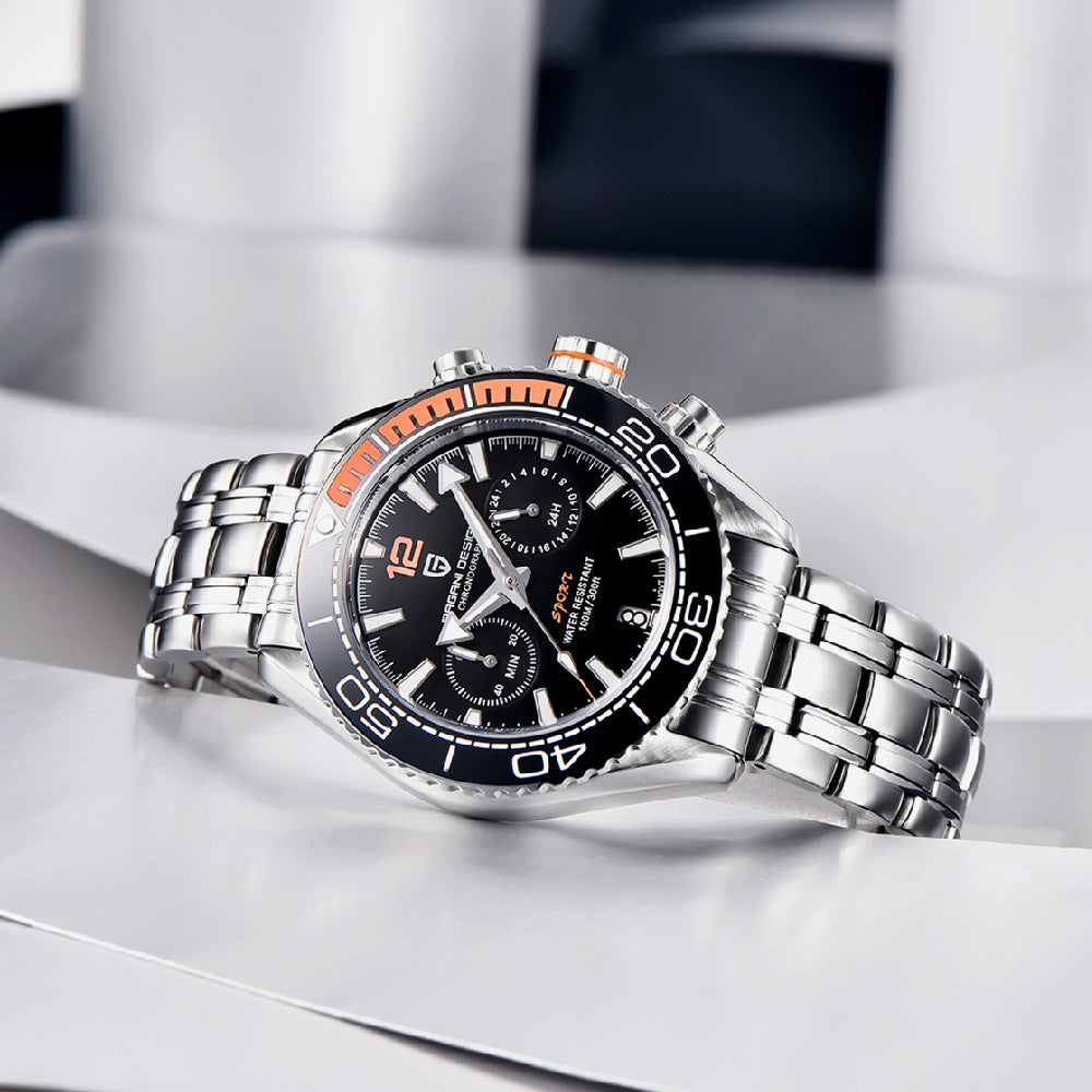 Silver watch with black face on a reflective surface