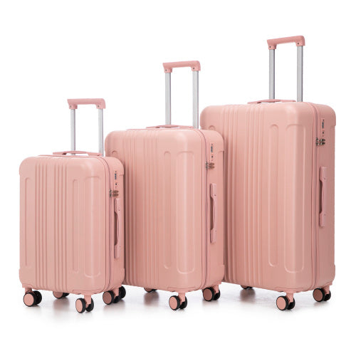 Set of three pink suitcases of different sizes on a white background