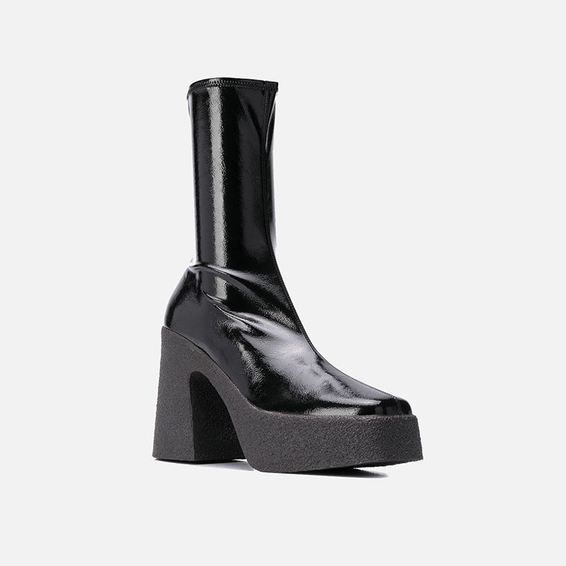 Black platform boot on a white background