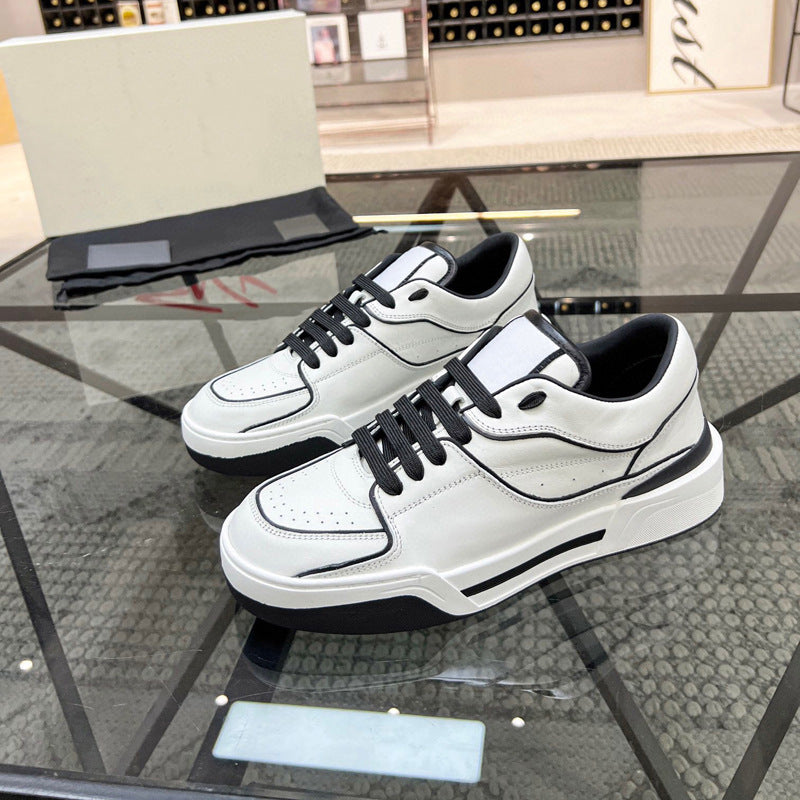 White sneakers with black accents on a glass table