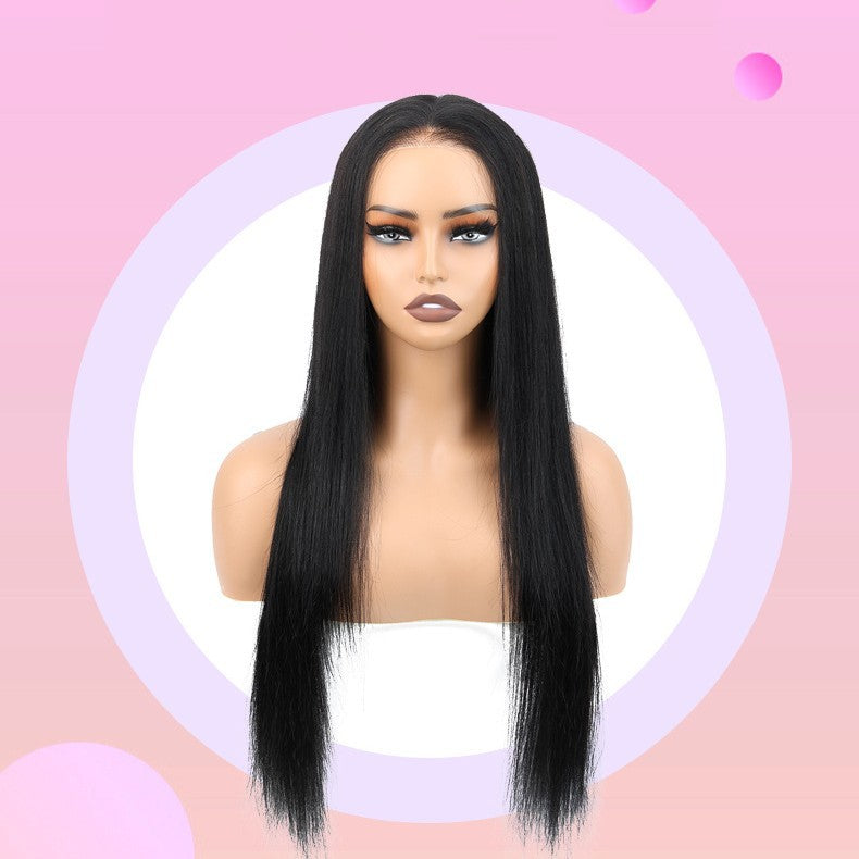 Mannequin head with long black straight wig on a pink background