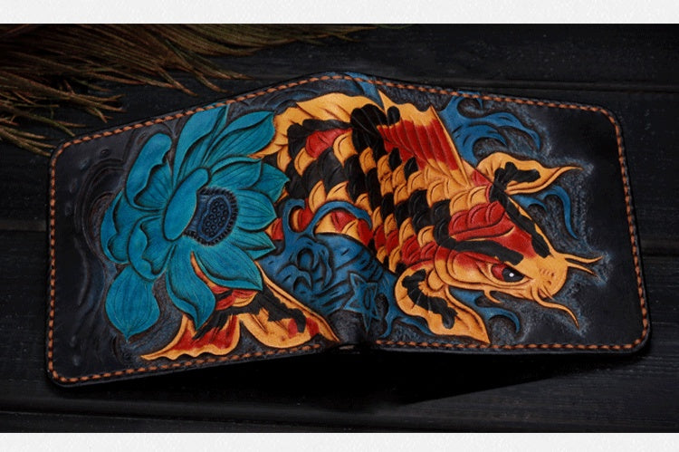 Handcrafted leather wallet with floral and dragon designs on a dark background