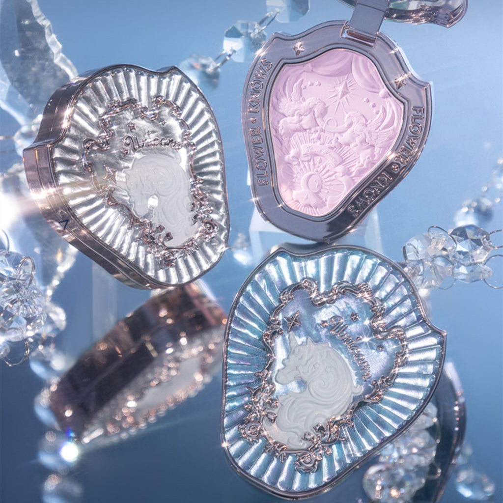 Three decorative compact mirrors with intricate designs on a blue background