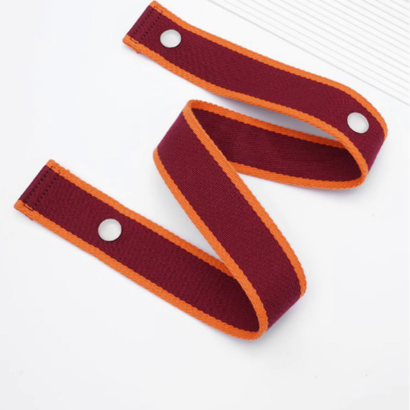 Two maroon wristbands with orange accents and silver buttons on a white background