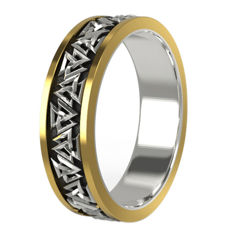 Two-tone ring with gold and silver design on a white background