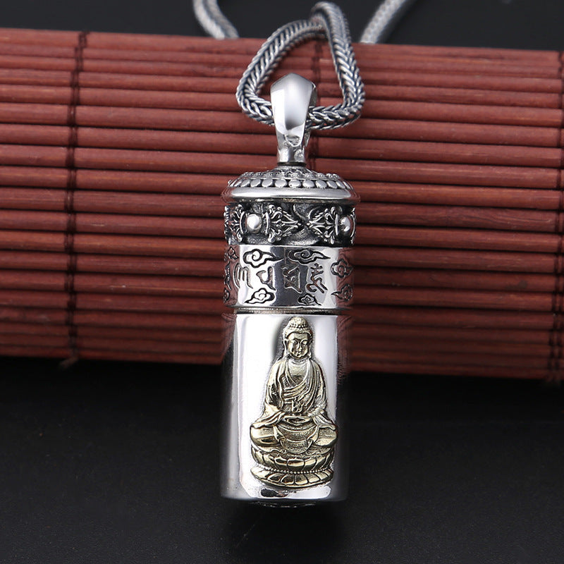 Silver pendant with Buddha figure on a dark background