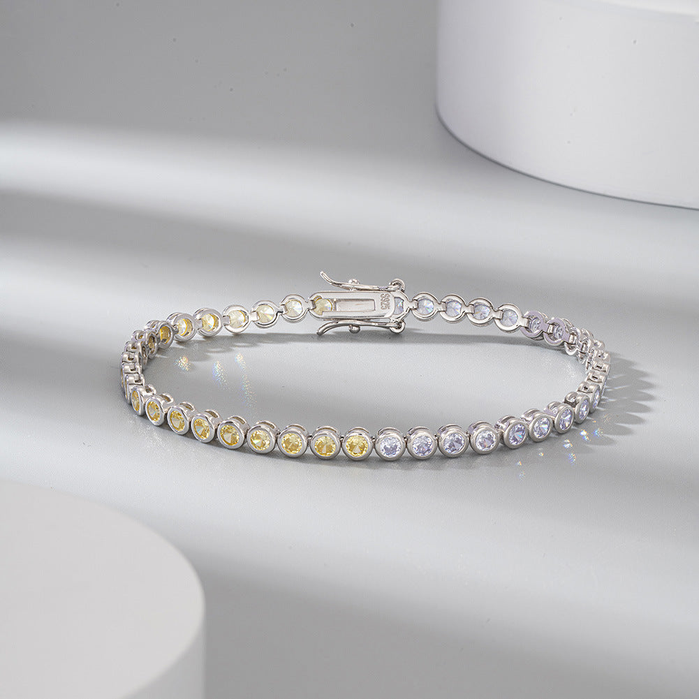 Silver bracelet with multicolored gemstones on a light gray background