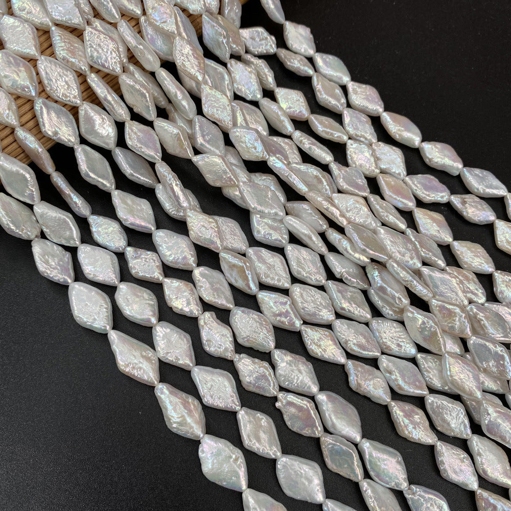 String of diamond-shaped beads with a metallic sheen on a dark background