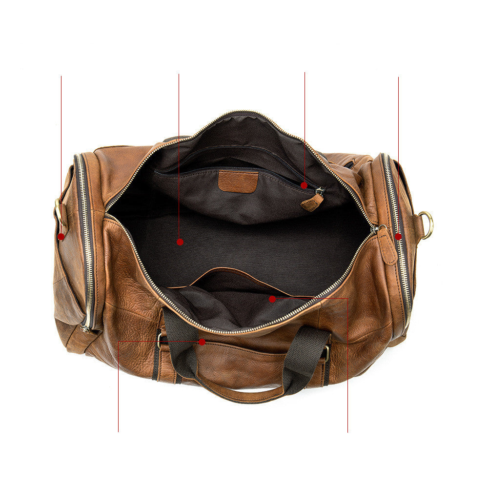 Brown leather duffel bag with open top on a white background
