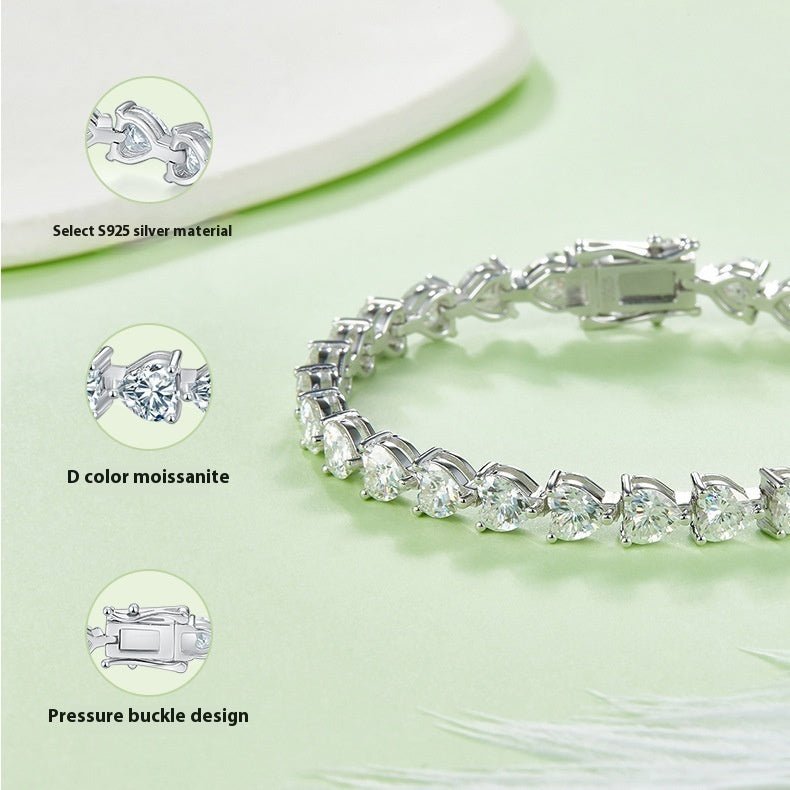 Silver bracelet with moissanite stones on a light green background