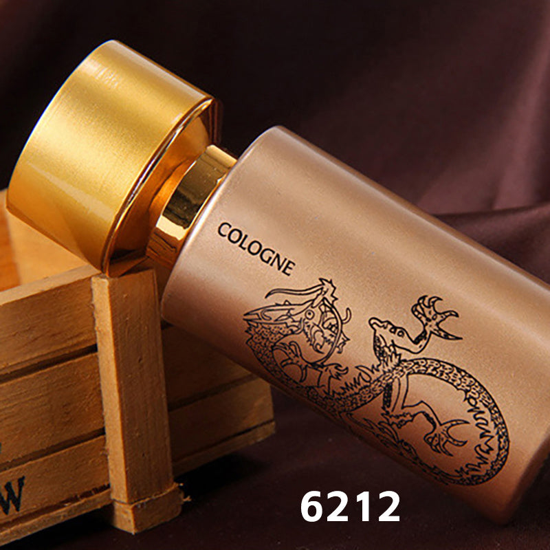 Cologne bottle with gold cap and wooden crate on a dark background