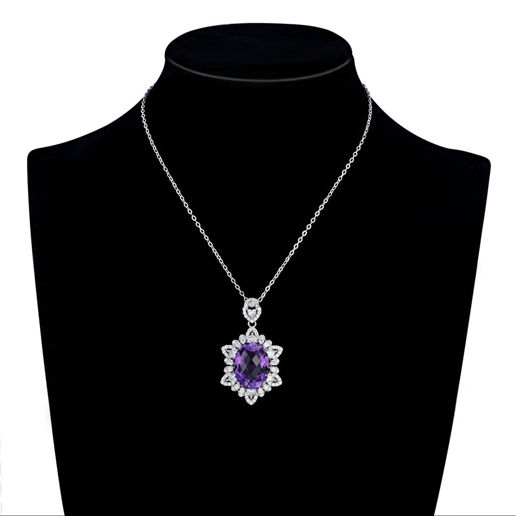 Necklace with a purple gemstone pendant on a black mannequin bust.