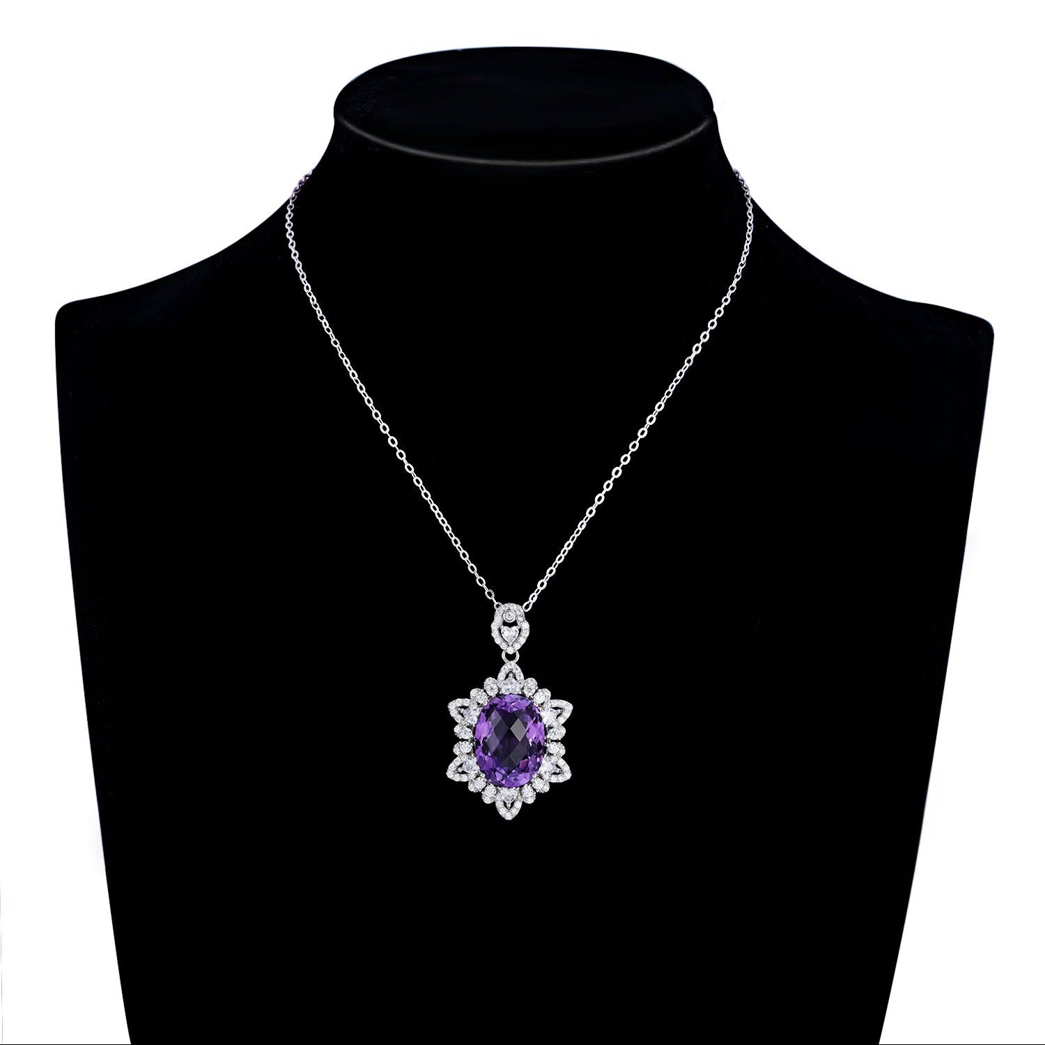 Necklace with a purple gemstone pendant on a black mannequin bust.