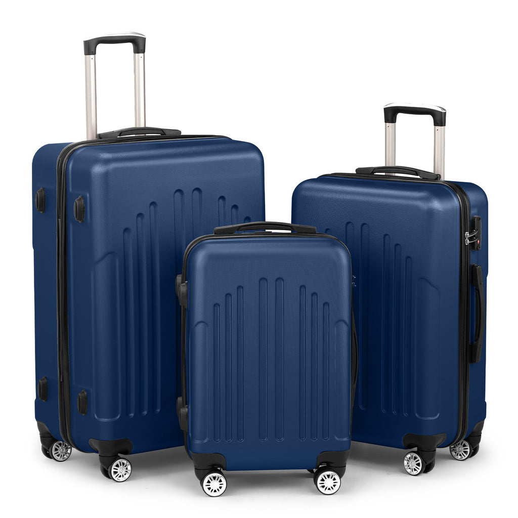 Set of three blue suitcases of different sizes on a white background