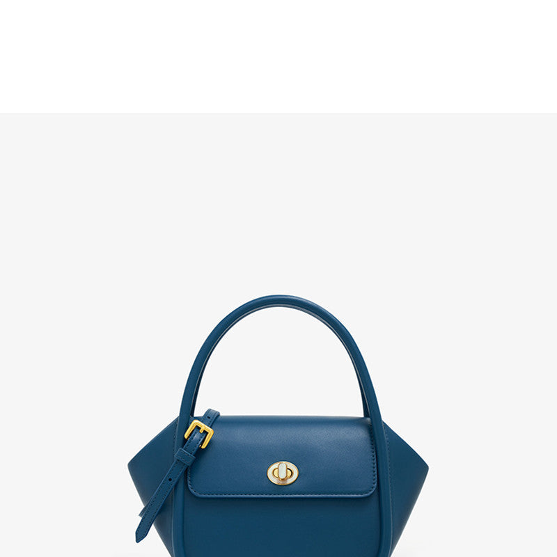 Blue handbag with a gold buckle on a white background
