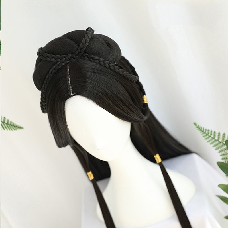 Black wig with braided design on a mannequin head against a white background