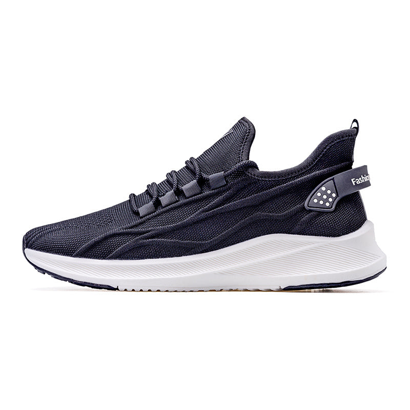 Navy running shoe with white sole on a white background