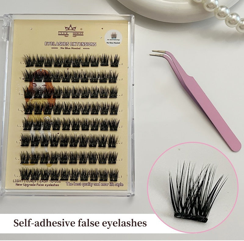 Set of self-adhesive false eyelashes with a pair of tweezers on a white surface.