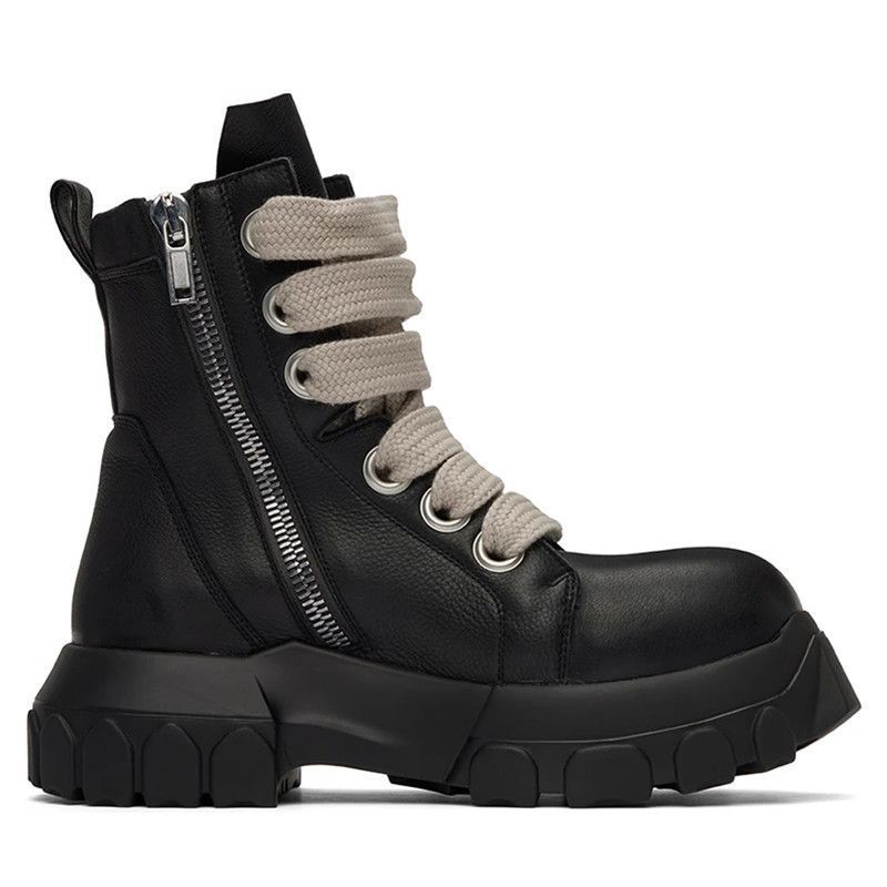 Black leather boot with beige laces on a white background