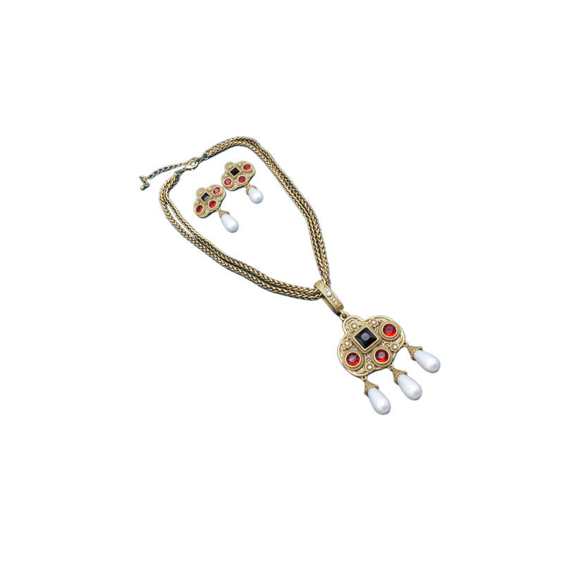 Jewelry set with necklace and earrings on a white background
