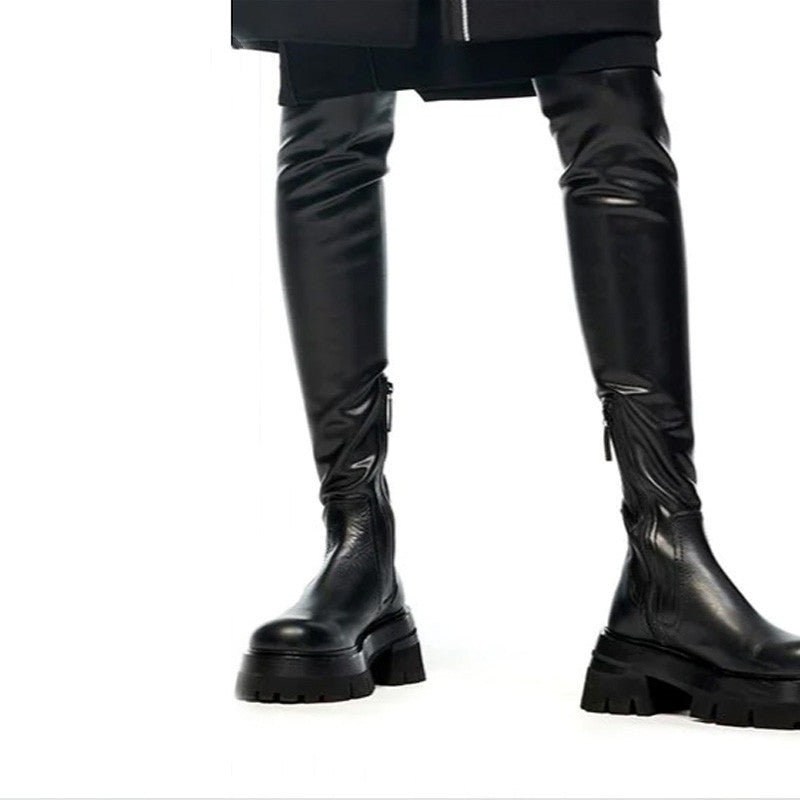 Black knee-high boots on a white background