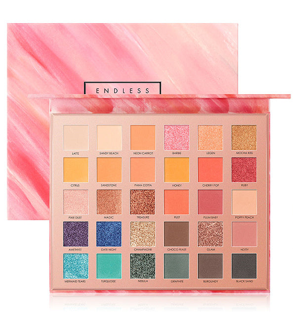 Makeup palette with colorful swatches and 'Endless' branding on a pink and white background