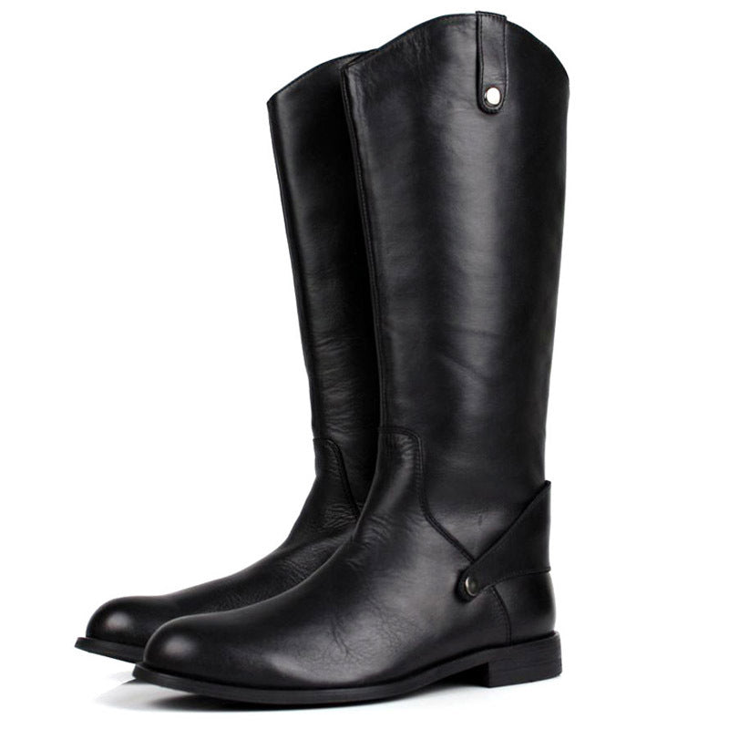 Pair of black leather riding boots on a white background