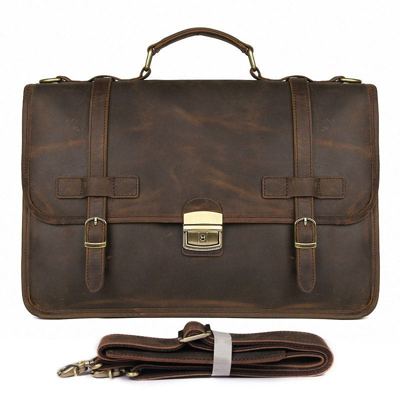 Brown leather briefcase with gold hardware on a white background