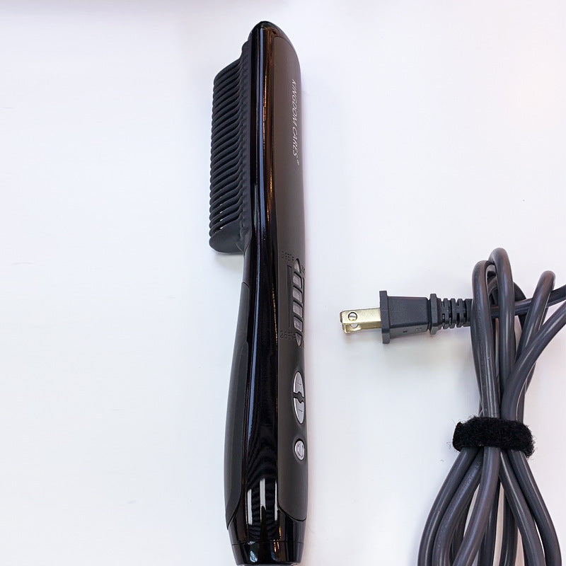 Black hair straightener with power cord on a white background