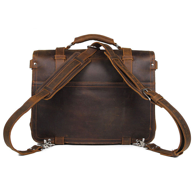 Brown leather satchel with shoulder straps on a white background