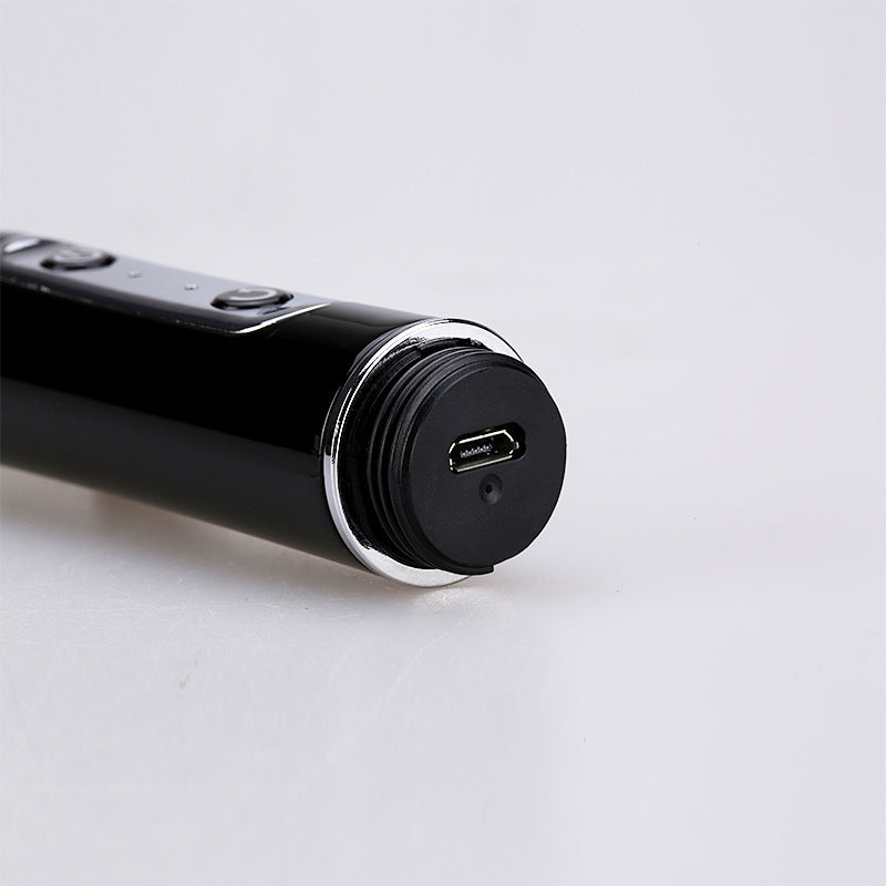 Black electronic device with USB port on a light gray background