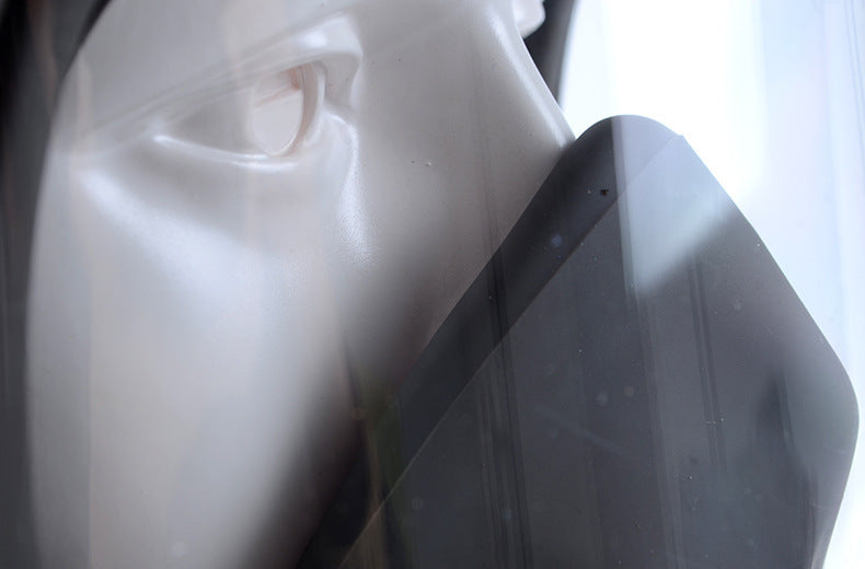 Close-up of a mannequin head with a blurred background