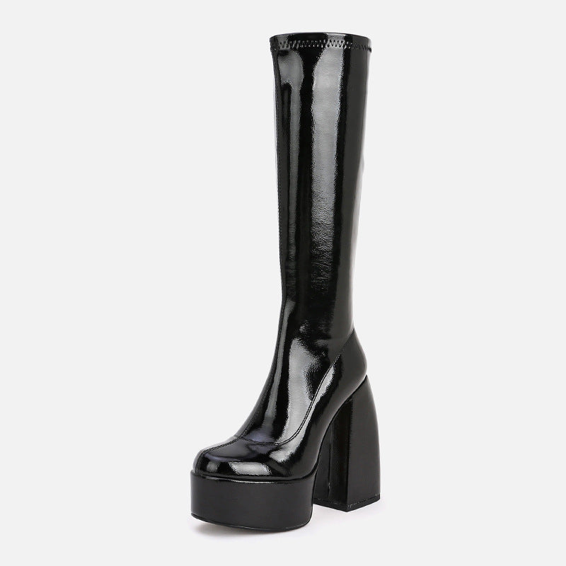 Black patent leather knee-high boot on a white background