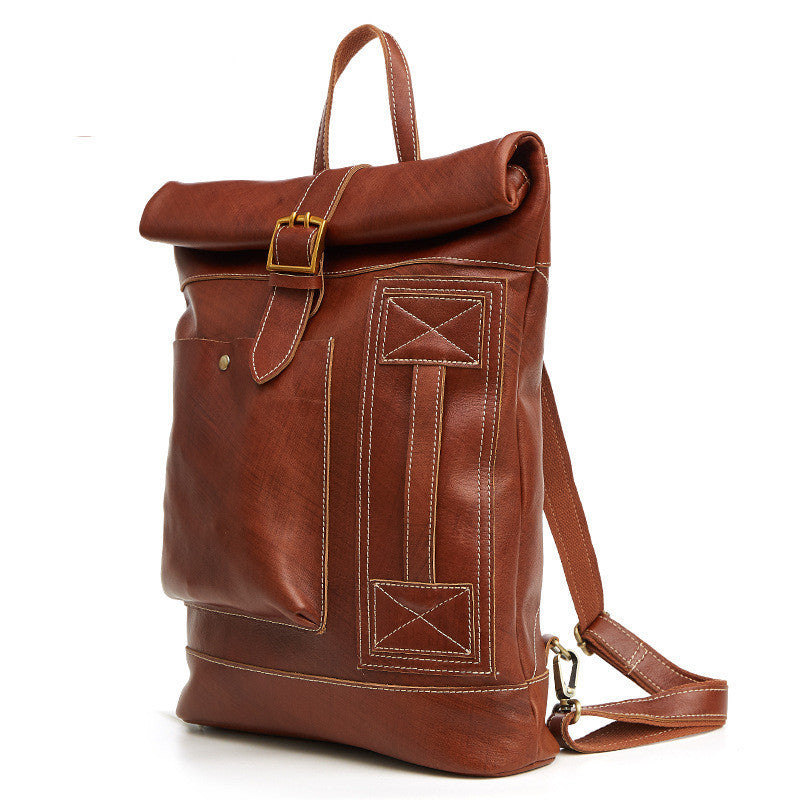 Brown leather backpack with gold buckle on a white background