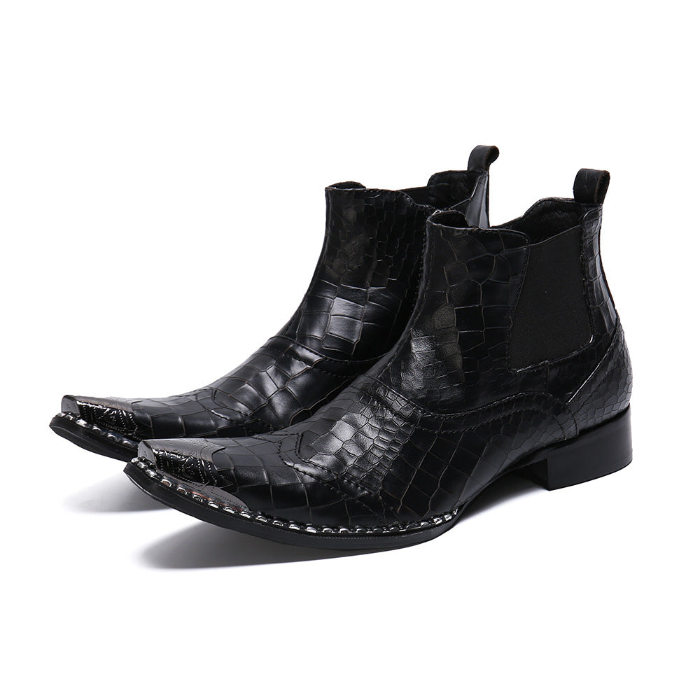 Black crocodile-patterned boots on a white background